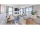Bright living room featuring a modern fireplace, large windows, and stylish decor at 4722 E Shadowbrook Dr, Camby, IN 46113