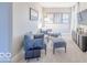 Sitting area with blue furniture, decor and natural light at 4722 E Shadowbrook Dr, Camby, IN 46113