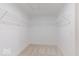 Walk-in closet with carpet and wire shelving for optimal storage solutions at 4722 E Shadowbrook Dr, Camby, IN 46113