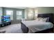 Bedroom with a large bed, a flatscreen TV, and multiple windows for plenty of natural light at 4948 Potomac Square Pl, Indianapolis, IN 46268