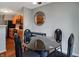 Cozy dining area next to an open kitchen, with a stylish glass table and chairs at 4948 Potomac Square Pl, Indianapolis, IN 46268