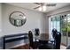 Chic dining room with a glass table, black chairs, and a modern mirror at 4948 Potomac Square Pl, Indianapolis, IN 46268