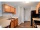 Functional kitchen featuring laminate countertops, wood cabinets, and stainless steel appliances at 4948 Potomac Square Pl, Indianapolis, IN 46268