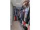 Walk-in closet featuring ample hanging storage for clothing and shelving above at 4948 Potomac Square Pl, Indianapolis, IN 46268
