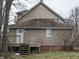 View of the back of the house showing the siding, deck, and backyard area at 501 N Tacoma Ave, Indianapolis, IN 46201