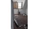 Unfinished bedroom with exposed framing and a window requiring significant renovation at 501 N Tacoma Ave, Indianapolis, IN 46201