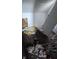 Dirty bedroom with stained carpet and an open door reveals the need for extensive repairs at 501 N Tacoma Ave, Indianapolis, IN 46201