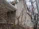 Side view of home, showing the siding, windows and trees at 501 N Tacoma Ave, Indianapolis, IN 46201