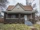 Charming two-story home with a cozy front porch and well-defined architectural details at 501 N Tacoma Ave, Indianapolis, IN 46201