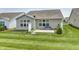 Green backyard with patio at 5110 Lilium Dr, Plainfield, IN 46168