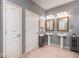 Stylish bathroom with dual vessel sinks, wooden framed mirrors and modern fixtures creating a spa-like atmosphere at 5110 Lilium Dr, Plainfield, IN 46168