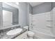 Well-lit bathroom with granite vanity top and tub at 5110 Lilium Dr, Plainfield, IN 46168