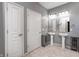 Bright bathroom featuring double sinks, modern lighting fixtures, and neutral tones at 5110 Lilium Dr, Plainfield, IN 46168