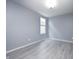 Serene bedroom with calming blue walls and light-filled window at 5110 Lilium Dr, Plainfield, IN 46168