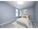 Comfortable bedroom with soft neutral tones, a cozy bed, and a side table with a lamp for a peaceful ambiance at 5110 Lilium Dr, Plainfield, IN 46168