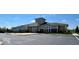 Exterior shot of the community clubhouse with manicured landscaping and convenient parking at 5110 Lilium Dr, Plainfield, IN 46168