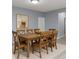 Traditional dining room with a wooden table, chairs, and a painting adding warmth and character at 5110 Lilium Dr, Plainfield, IN 46168