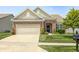 Charming single-story home with brick accents, a two-car garage, and a well-maintained front yard at 5110 Lilium Dr, Plainfield, IN 46168