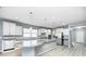 Modern kitchen with a large island, stainless steel appliances, and ample cabinet space at 5110 Lilium Dr, Plainfield, IN 46168
