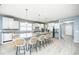 Modern kitchen featuring a large island with seating, stainless steel appliances, and ample cabinet space at 5110 Lilium Dr, Plainfield, IN 46168