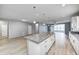 Open concept kitchen with island, stainless appliances, and view of the living space at 5110 Lilium Dr, Plainfield, IN 46168