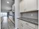 Modern kitchen showcasing granite countertops, stainless appliances, and white cabinetry at 5110 Lilium Dr, Plainfield, IN 46168