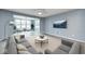 Inviting living room with comfortable seating, a flat-screen TV, and plenty of natural light at 5110 Lilium Dr, Plainfield, IN 46168