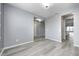 Spacious living room with stylish flooring, gray walls and an open layout perfect for modern living at 5110 Lilium Dr, Plainfield, IN 46168