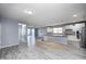 Open living area with a view into kitchen that features stainless steel appliances at 5110 Lilium Dr, Plainfield, IN 46168