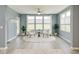 Cozy living room features large windows, comfortable seating, and a view of the outdoors at 5110 Lilium Dr, Plainfield, IN 46168
