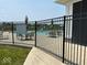 Community pool area featuring comfortable seating and shade umbrellas behind a secure fence at 5110 Lilium Dr, Plainfield, IN 46168