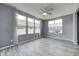 Sun-drenched sunroom featuring large windows, stylish flooring, and a cozy, inviting atmosphere at 5110 Lilium Dr, Plainfield, IN 46168