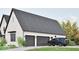 Spacious two-car garage with a sleek dark door, set against a well-maintained white brick home at 5488 Stonewood Ct, Bargersville, IN 46106
