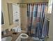 Neat bathroom with combined shower-tub with modern shower curtain and tile flooring at 5703 Wood Hollow Dr, Indianapolis, IN 46239
