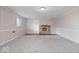 Finished basement featuring neutral carpet, a fireplace, and paneled walls at 5719 Laurel Hall Dr, Indianapolis, IN 46226
