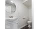 A simple bathroom features a toilet, a sink, and a mirror at 5719 Laurel Hall Dr, Indianapolis, IN 46226