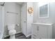 A functional bathroom features a toilet, sink, and a shower at 5719 Laurel Hall Dr, Indianapolis, IN 46226