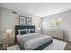 Serene bedroom with a plush bed, calming colors, soft lighting, and modern decor elements at 5719 Laurel Hall Dr, Indianapolis, IN 46226