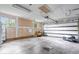 A large two car garage with bare walls and a concrete floor at 5719 Laurel Hall Dr, Indianapolis, IN 46226