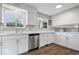 Bright, modern kitchen featuring white cabinets, stainless steel appliances, and ample counter space at 5719 Laurel Hall Dr, Indianapolis, IN 46226