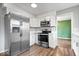 Modern kitchen with stainless steel appliances, white cabinets, and updated countertops at 5719 Laurel Hall Dr, Indianapolis, IN 46226