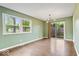 Bright living room featuring hardwood floors, and natural light from the large windows at 5719 Laurel Hall Dr, Indianapolis, IN 46226