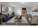Elegant living room with a cozy fireplace, stylish furnishings, and a modern decor at 5719 Laurel Hall Dr, Indianapolis, IN 46226