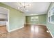 Spacious living room featuring hardwood floors, natural light, and access to the kitchen at 5719 Laurel Hall Dr, Indianapolis, IN 46226