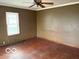 Spacious bedroom featuring a ceiling fan, natural light, and a blank canvas for customization at 598 Young St, Franklin, IN 46131