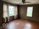 Living room with lots of natural light through large windows and a ceiling fan for comfort at 598 Young St, Franklin, IN 46131