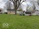 Wide yard offers generous outdoor space and features a storage shed on the property at 598 Young St, Franklin, IN 46131