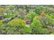 Aerial view of home in a neighborhood with mature trees and a well-manicured lawn at 6340 Monitor Ln, Indianapolis, IN 46220