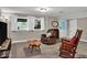 Finished basement features windows, an entertainment setup, and plenty of seating at 6340 Monitor Ln, Indianapolis, IN 46220