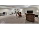 Large basement space with entertainment and exercise areas, perfect for a home gym or Gathering room at 6340 Monitor Ln, Indianapolis, IN 46220